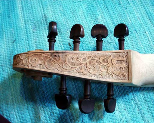 scroll and pegbox with bass relief